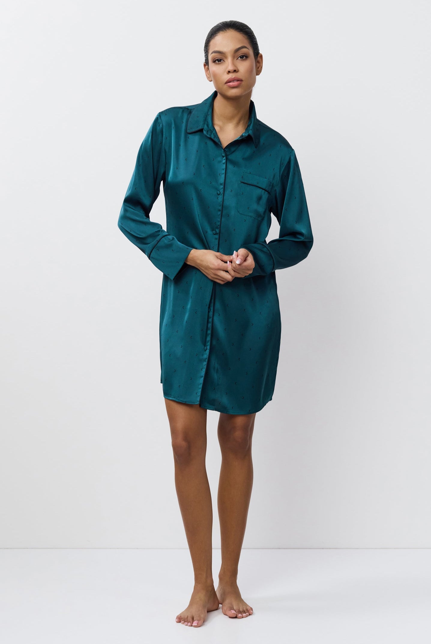 Woman wearing a nightdress against a white background