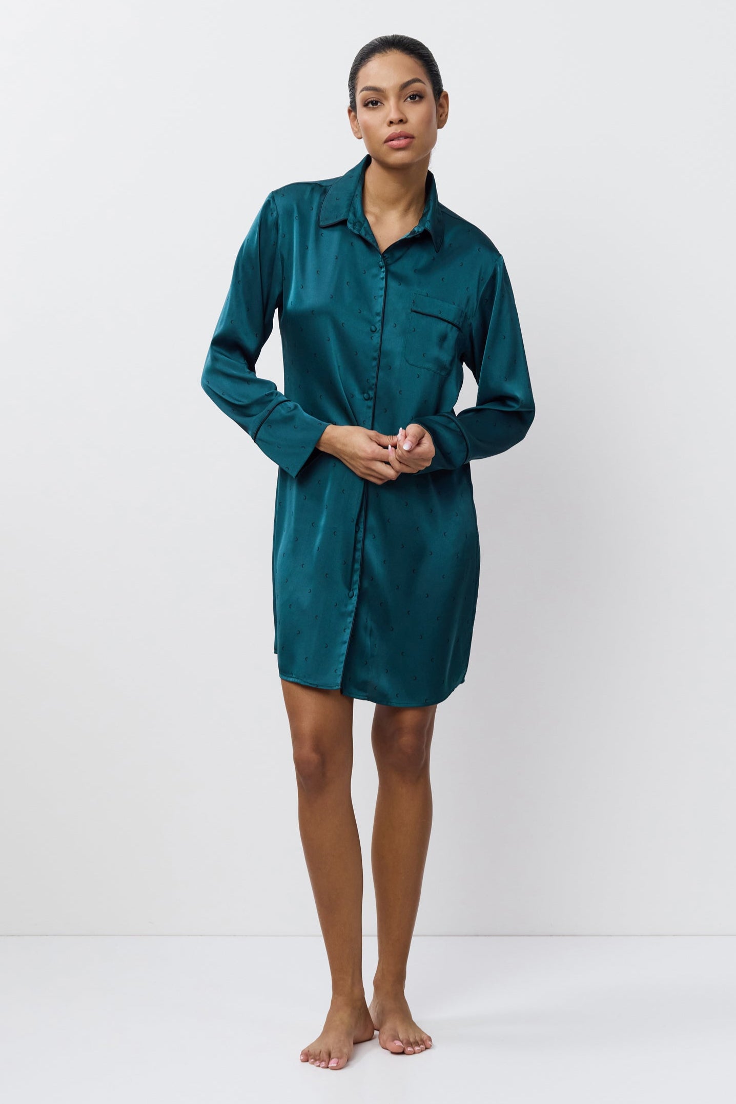 Woman wearing a nightdress against a white background