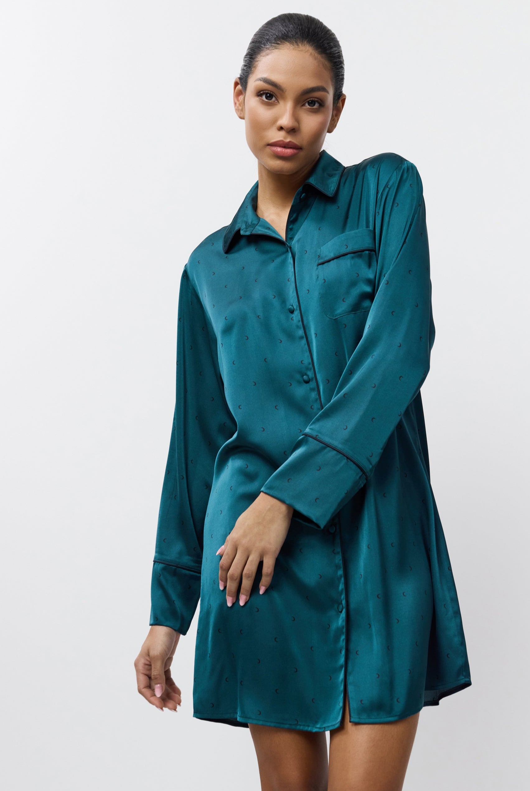 Woman wearing a nightdress against a white background