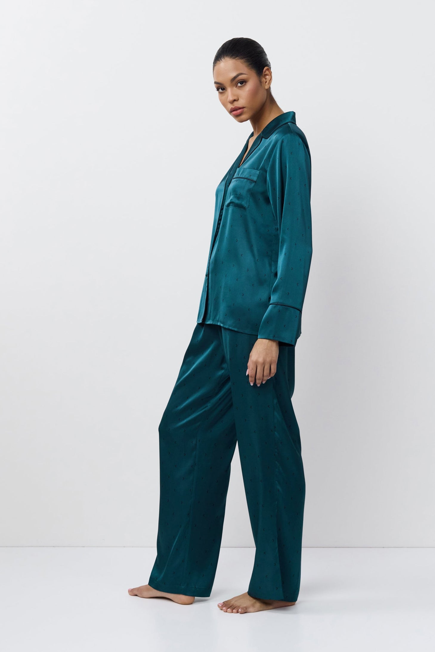 Woman wearing pajama set against a white background