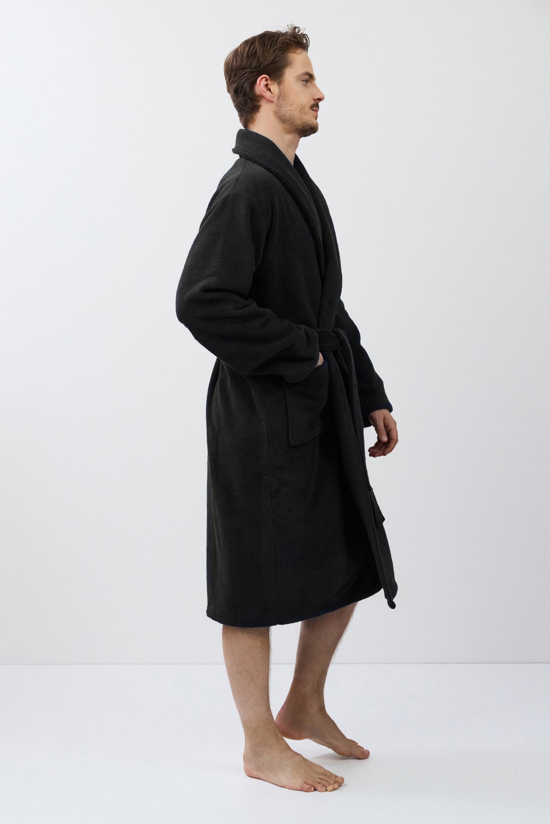 Man wearing a black robe on a white background