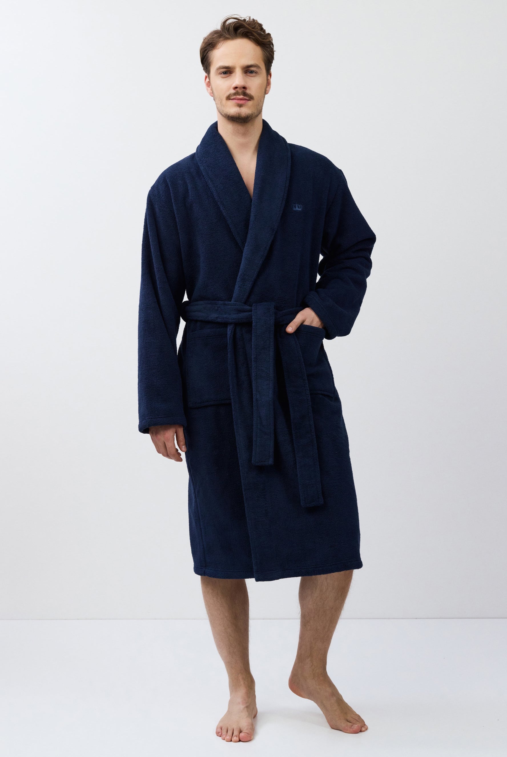 Man wearing a navy blue robe on a white background