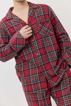 Red plaid pajama set worn by a person on a white background