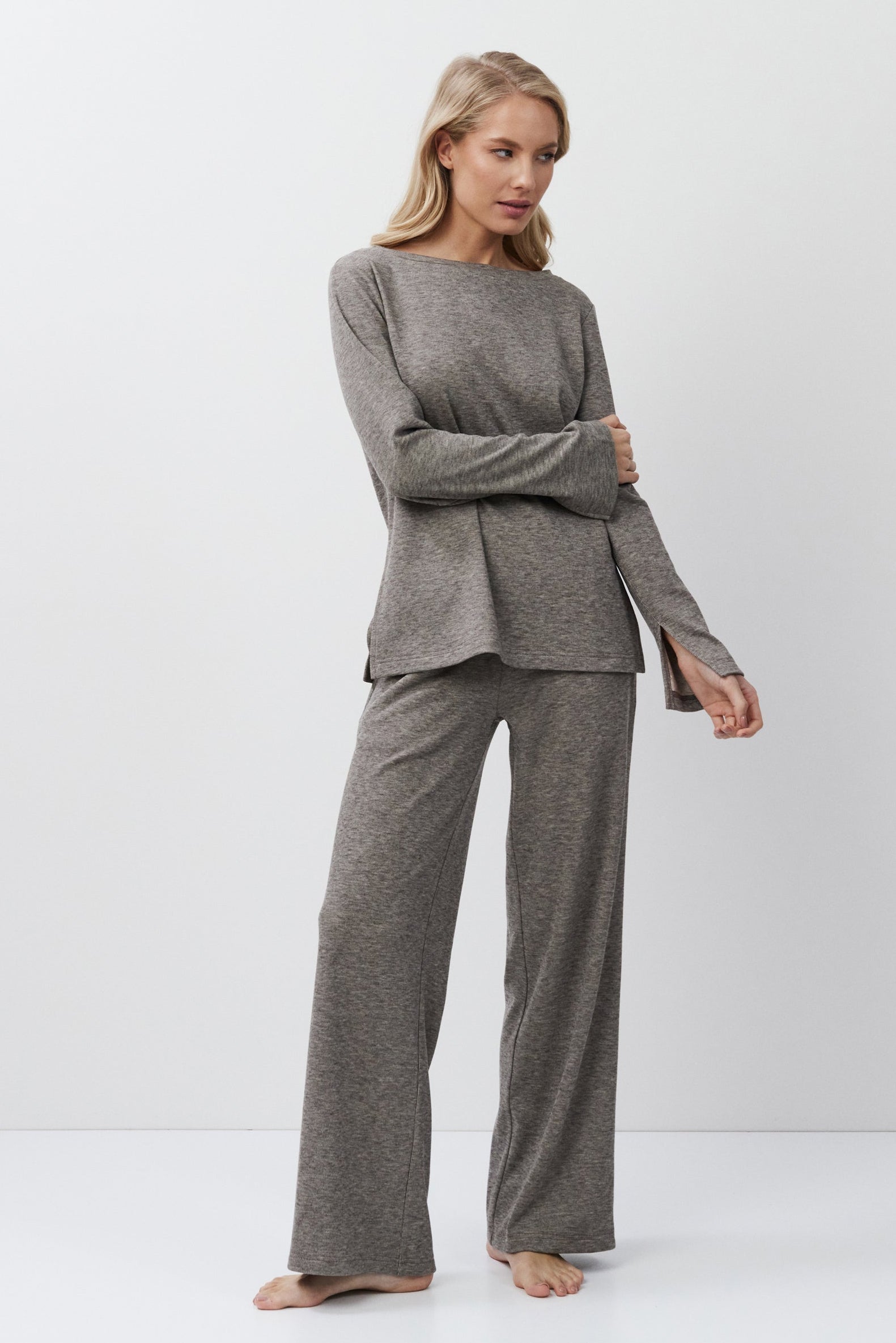 Woman wearing a brown outfit on a white background