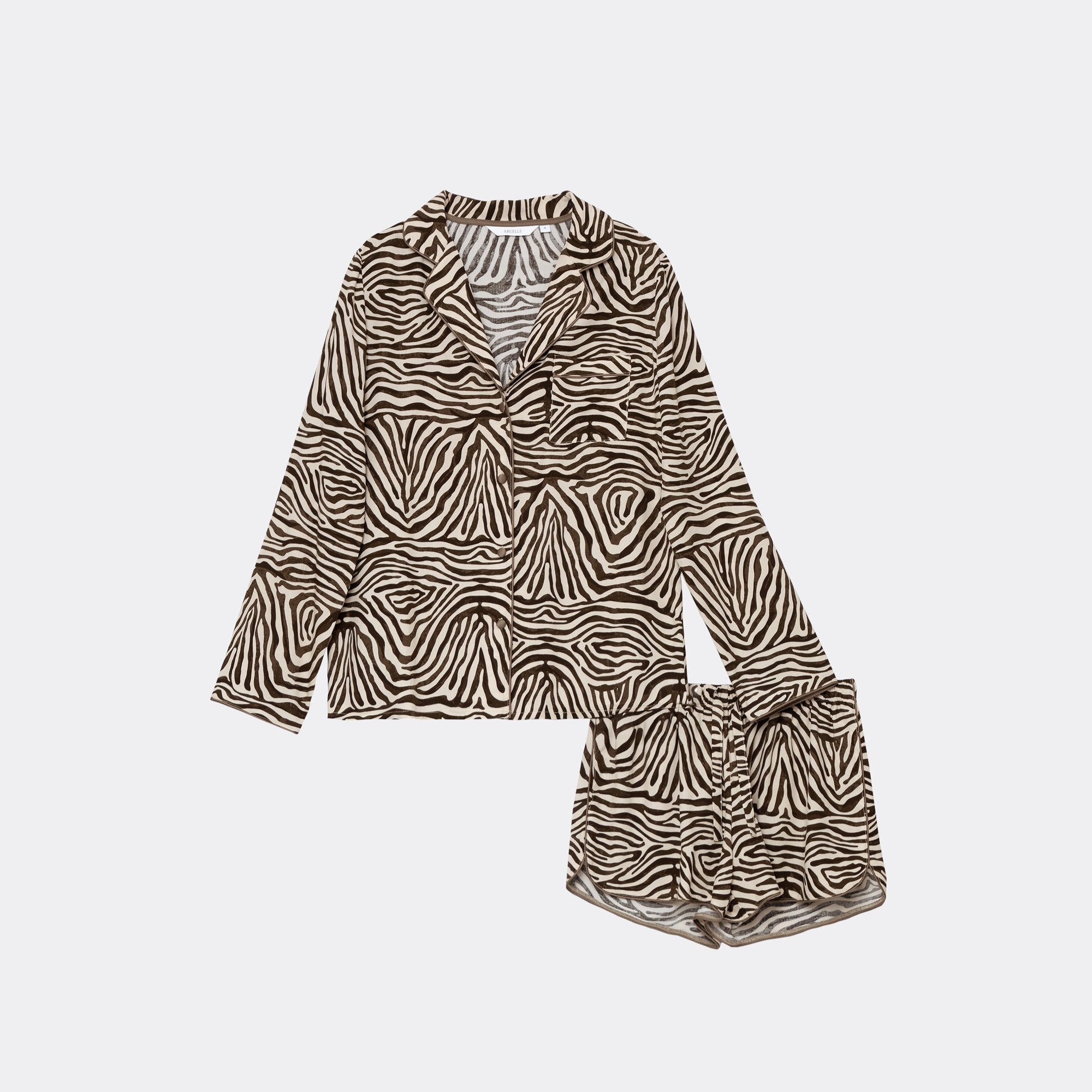 Zebra print pajama set with a top and shorts on a white background